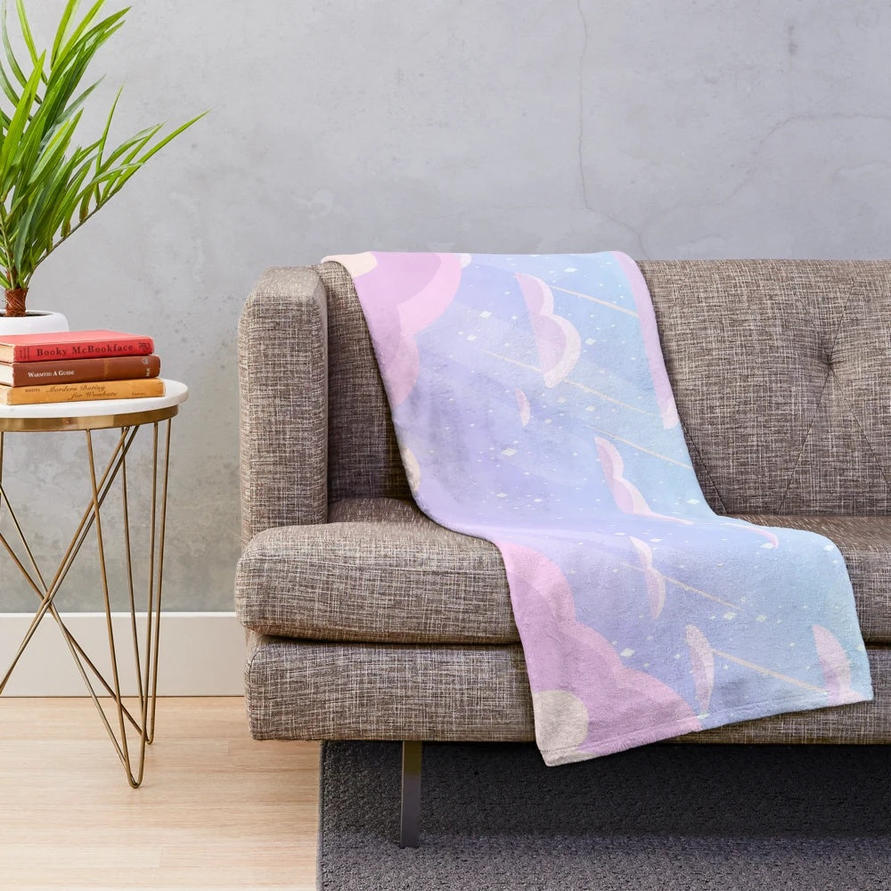 Pastel-colored plush blanket with cloud and star design