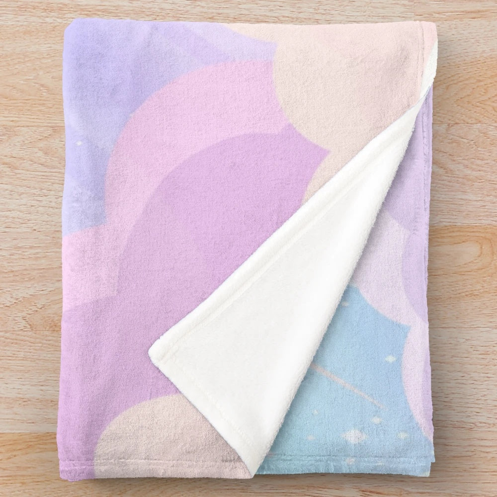 Pastel-colored plush blanket with cloud and star design