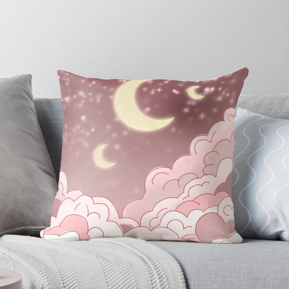 A pink cloud-shaped pillow with a whimsical fairy art design, perfect for napping and relaxation.