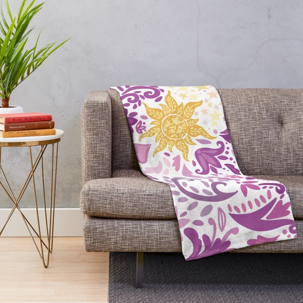 Soft and plush blanket with a sun design inspired by princesses