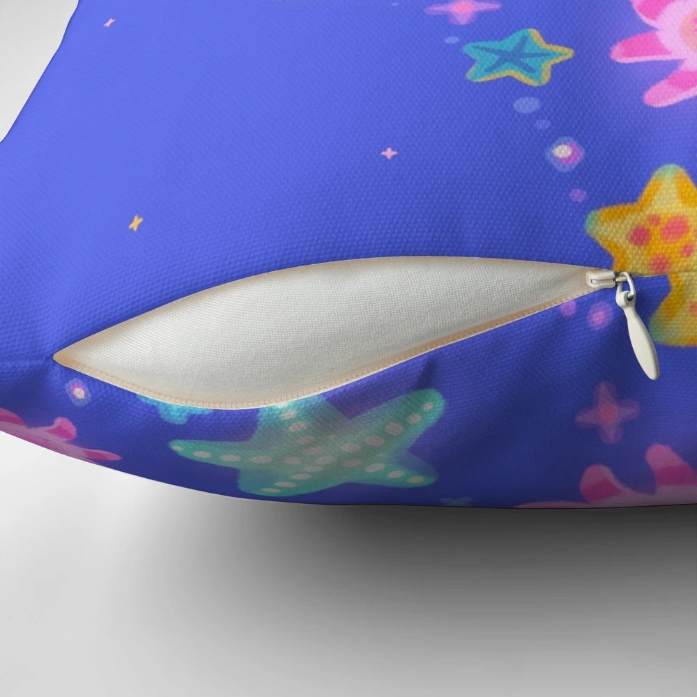 Soft, plush pillow featuring a sun and starfish design, capturing the beauty of marine life