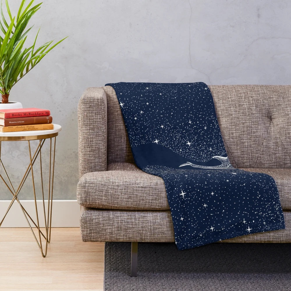 Plush blanket featuring a surreal artwork of a whale shark in a star-filled galaxy