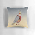A decorative pillow featuring a cockatiel in a whimsical costume