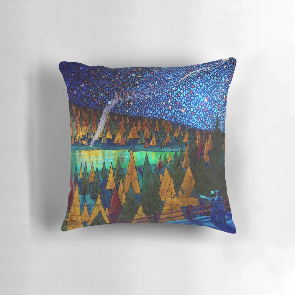 A plush pillow featuring a starry night sky design, perfect for travel and camping.