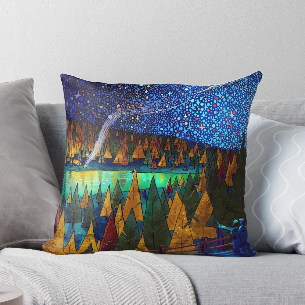 A plush pillow featuring a starry night sky design, perfect for travel and camping.