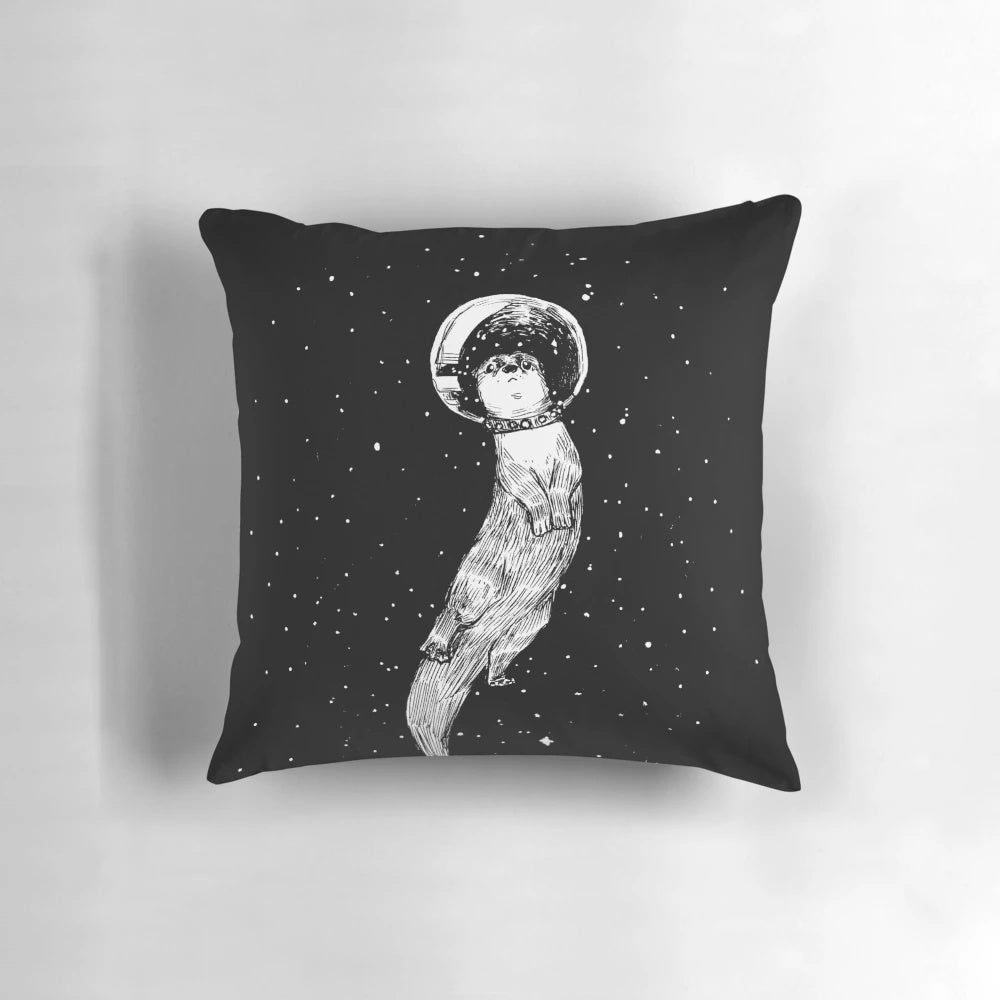 Colorful pillow featuring a drifting otter in a starry outer space scene