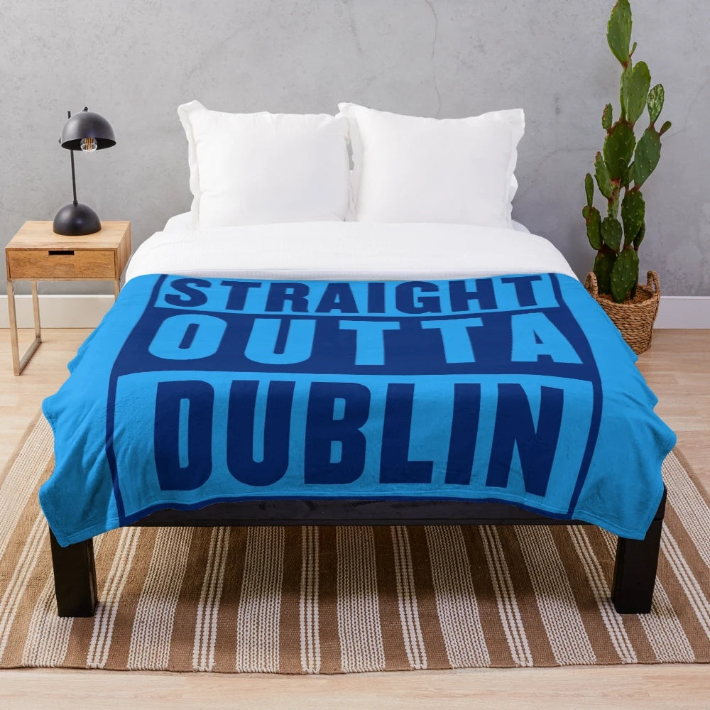 Dublin-inspired plush blanket with music and sports motifs