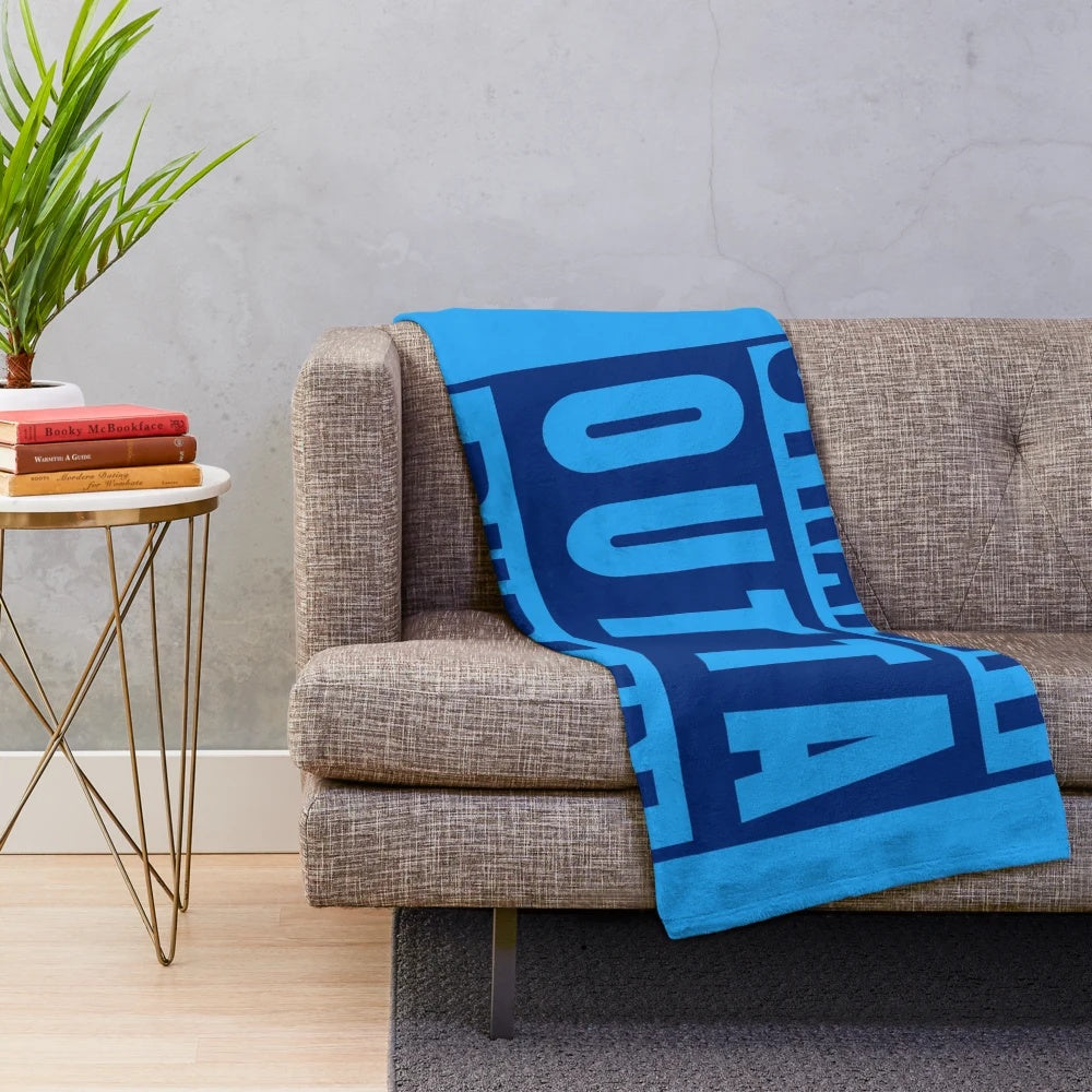 Dublin-inspired plush blanket with music and sports motifs