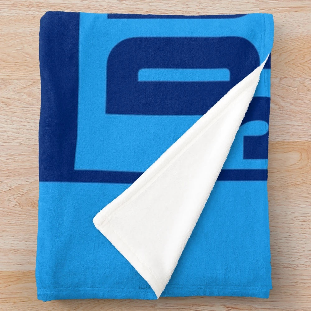 Dublin-inspired plush blanket with music and sports motifs