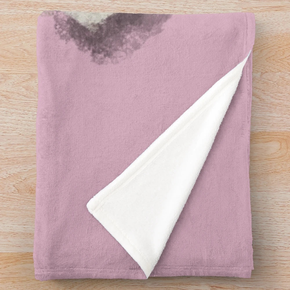 Plush blanket featuring a soft, cozy design inspired by the sheepdog breed