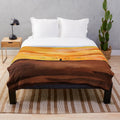 Dune-inspired plush blanket with a captivating desert sunset design