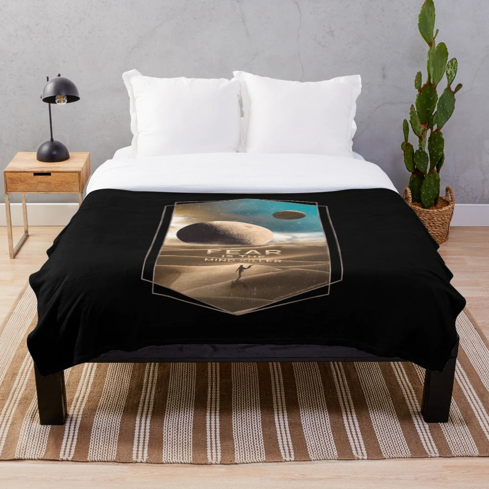 Dune-inspired plush blanket with Muad'Dib symbol on Arrakis desert