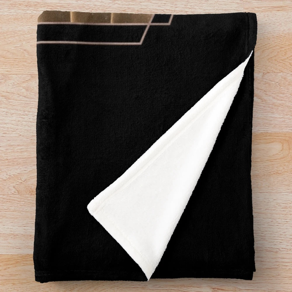 Dune-inspired plush blanket with Muad'Dib symbol on Arrakis desert