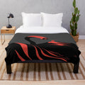 A plush blanket featuring an illustration of the iconic sandworm from the Dune series