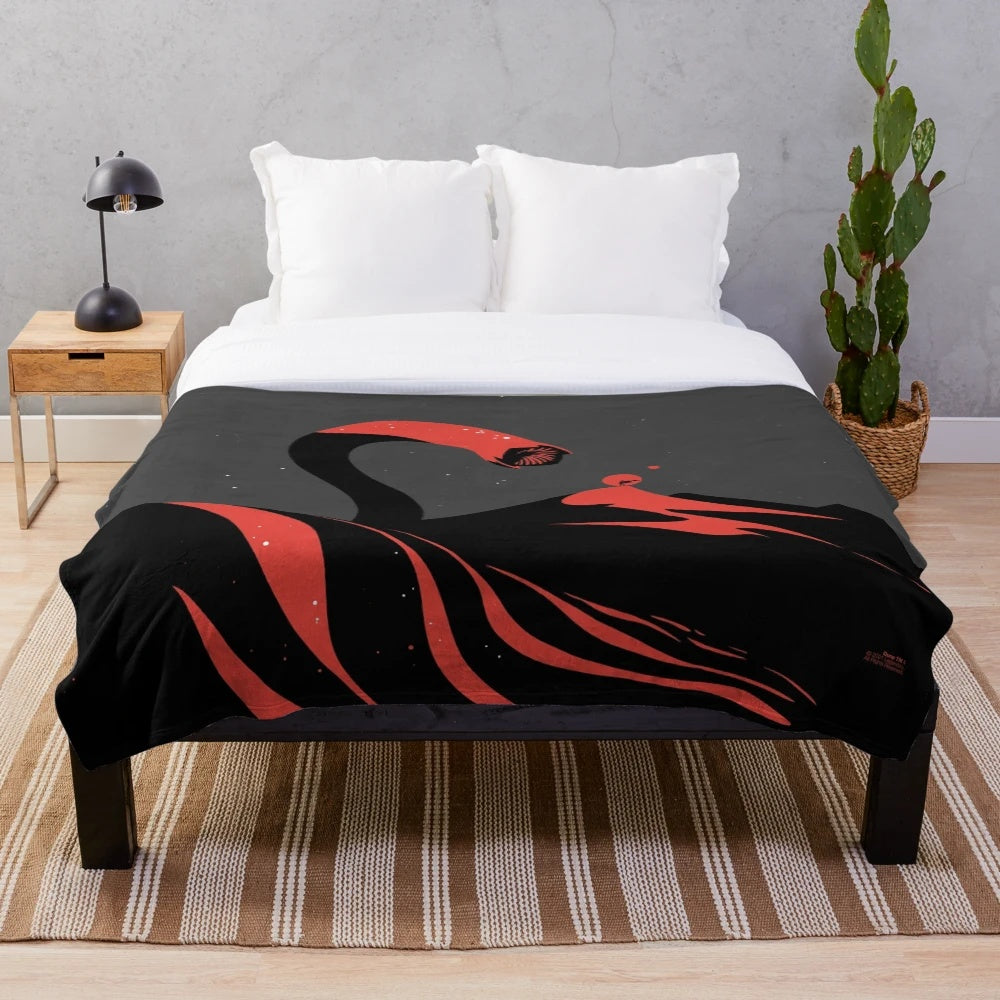 A plush blanket featuring an illustration of the iconic sandworm from the Dune series