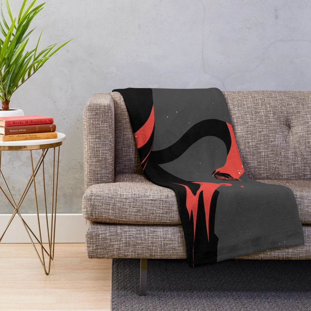 A plush blanket featuring an illustration of the iconic sandworm from the Dune series