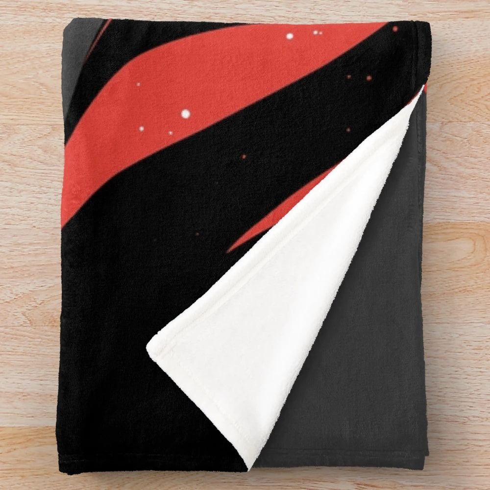 A plush blanket featuring an illustration of the iconic sandworm from the Dune series