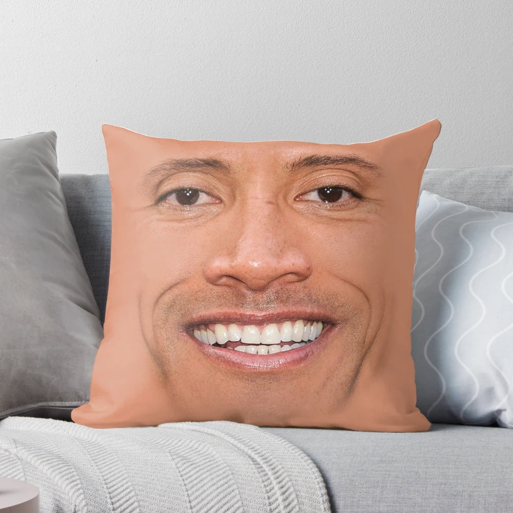 Graphic illustration of Dwayne Johnson's face on a plush pillow