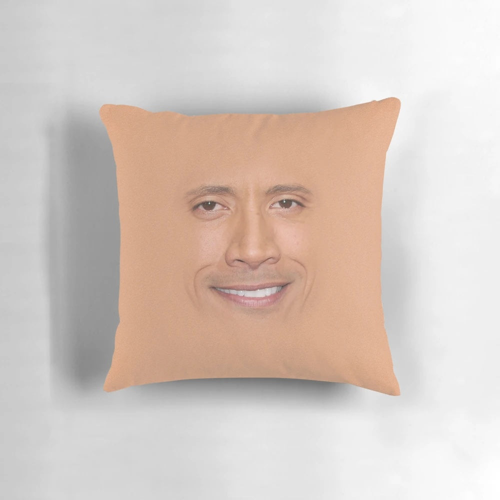 Dwayne "The Rock" Johnson's famous face printed on a plush pillow