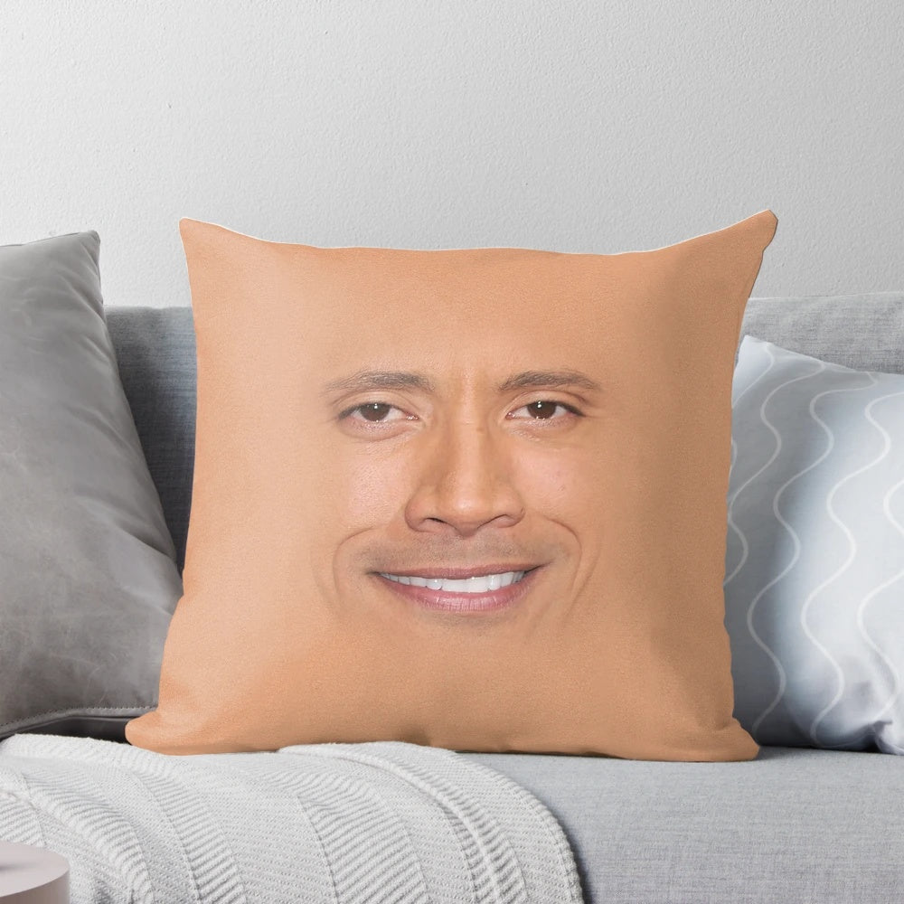Dwayne "The Rock" Johnson's famous face printed on a plush pillow