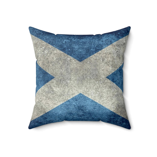 A vintage-style pillow featuring the Scottish flag, with a distressed, textured appearance.