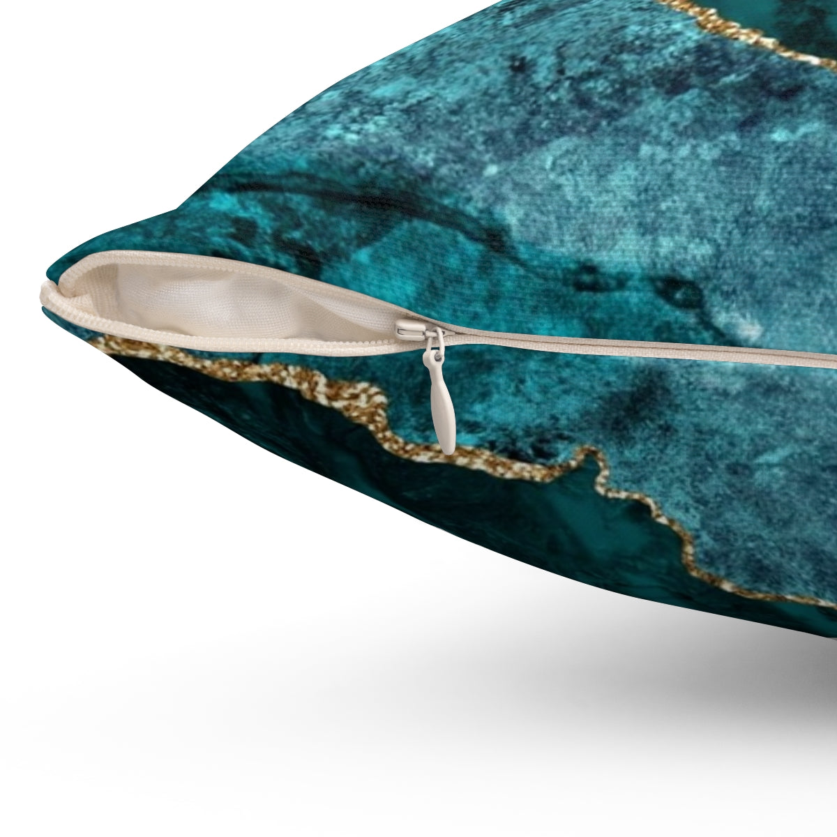 Teal and gold agate-inspired decorative pillow with a geode-like texture - Detail