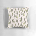 A decorative throw pillow featuring a hand-drawn pattern of stylized fir trees in shades of green.
