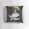 Watercolor painting of an endangered sea turtle on a decorative throw pillow with a message about climate change and environmental protection.