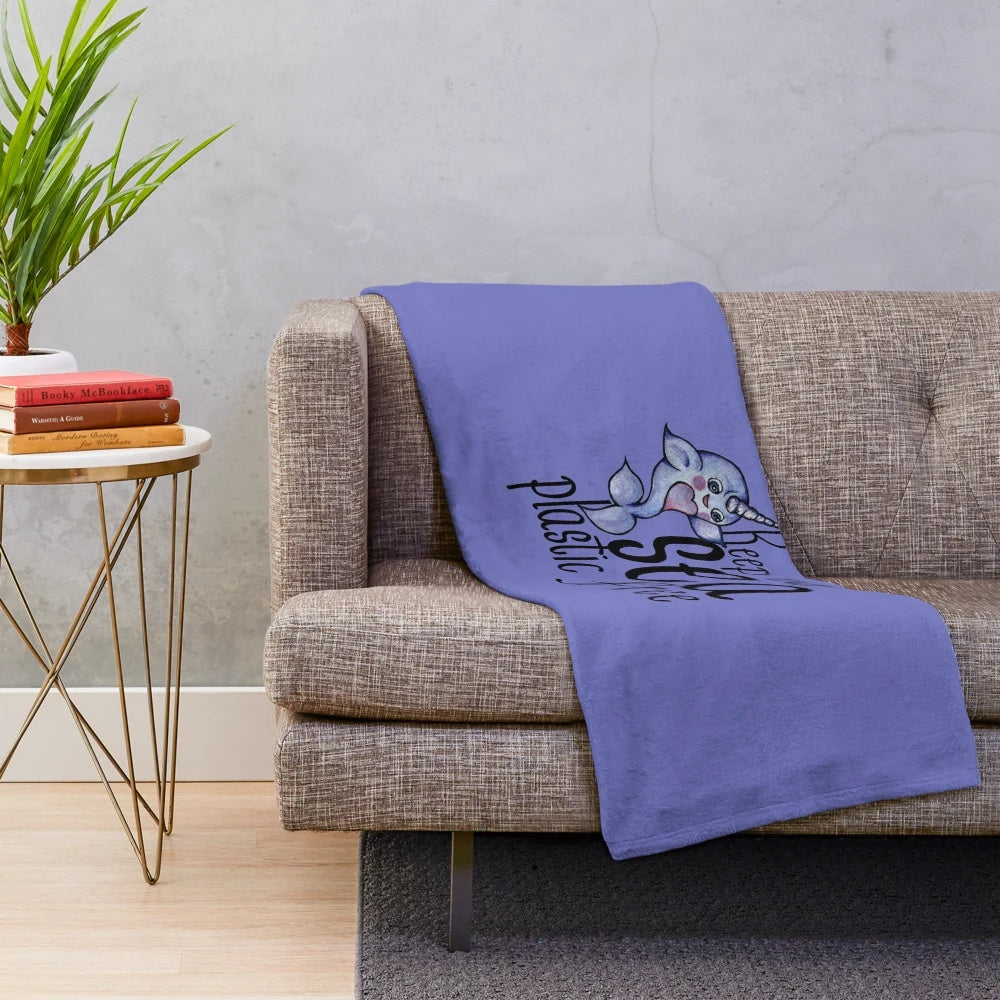 Narwhal plush blanket with "Keep our sea plastic free" message