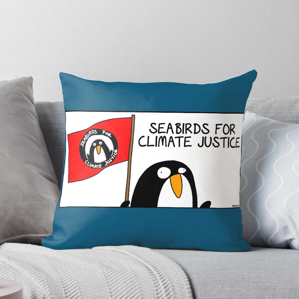 A soft and cozy pillow featuring an illustration of seabirds, promoting climate justice and environmental protection.