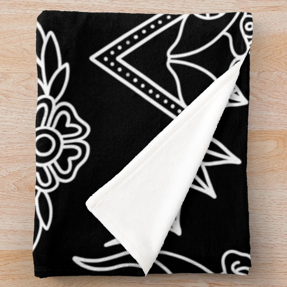 Black and white plush blanket with traditional tattoo pattern design