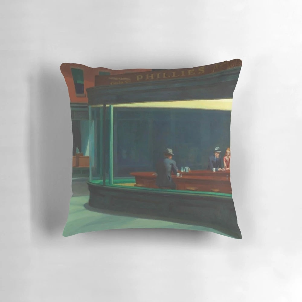 Edward Hopper's famous 'Nighthawks' painting printed on a decorative throw pillow