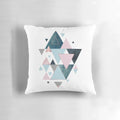 Stylish abstract triangle pattern pillow in shades of pink, teal, and blue