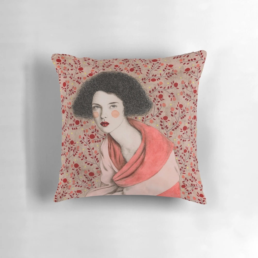 Decorative pink and white pattern pillow featuring a portrait of a woman