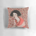 Decorative pink and white pattern pillow featuring a portrait of a woman