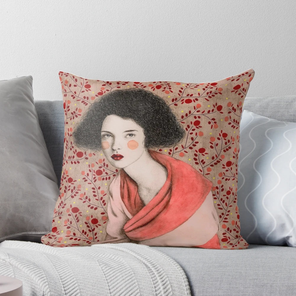 Decorative pink and white pattern pillow featuring a portrait of a woman