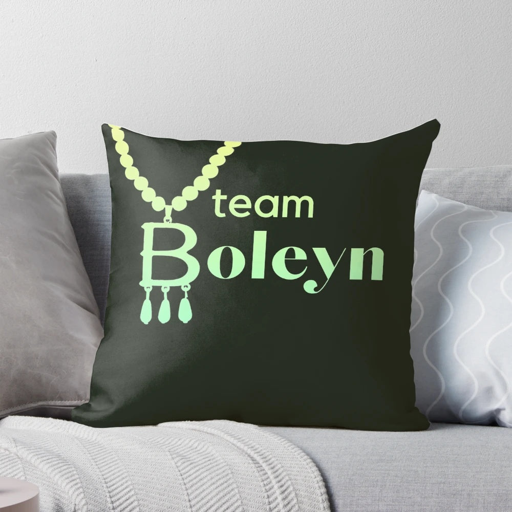 Plush green pillow with embroidered Anne Boleyn Six Wives necklace slogan design
