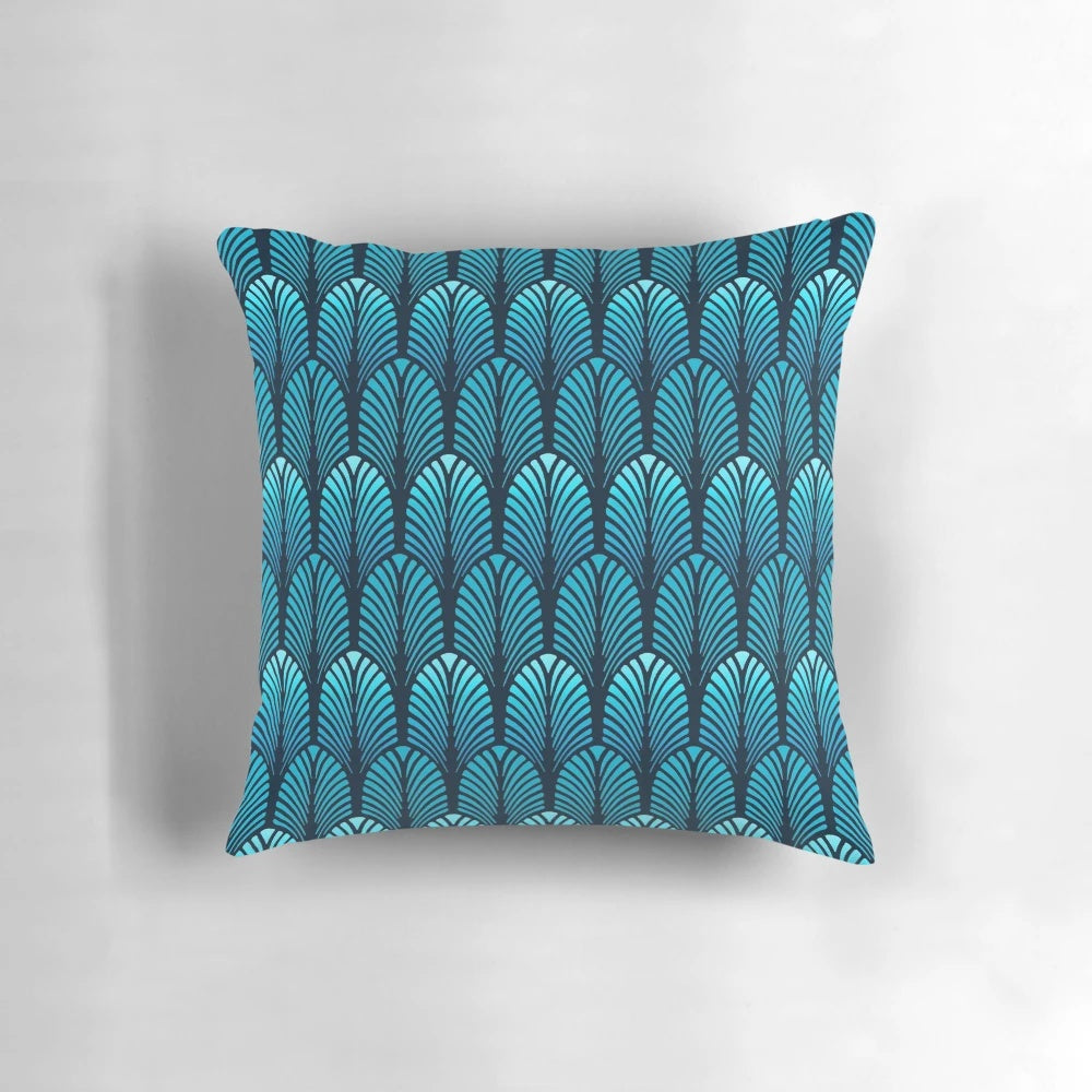 Sapphire blue throw pillow with an art deco feather pattern design
