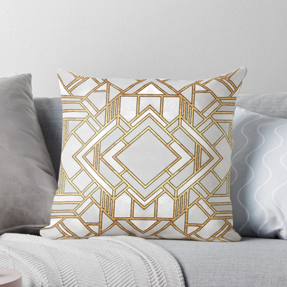 Stylish art deco-inspired throw pillow with abstract geometric patterns in gold and white