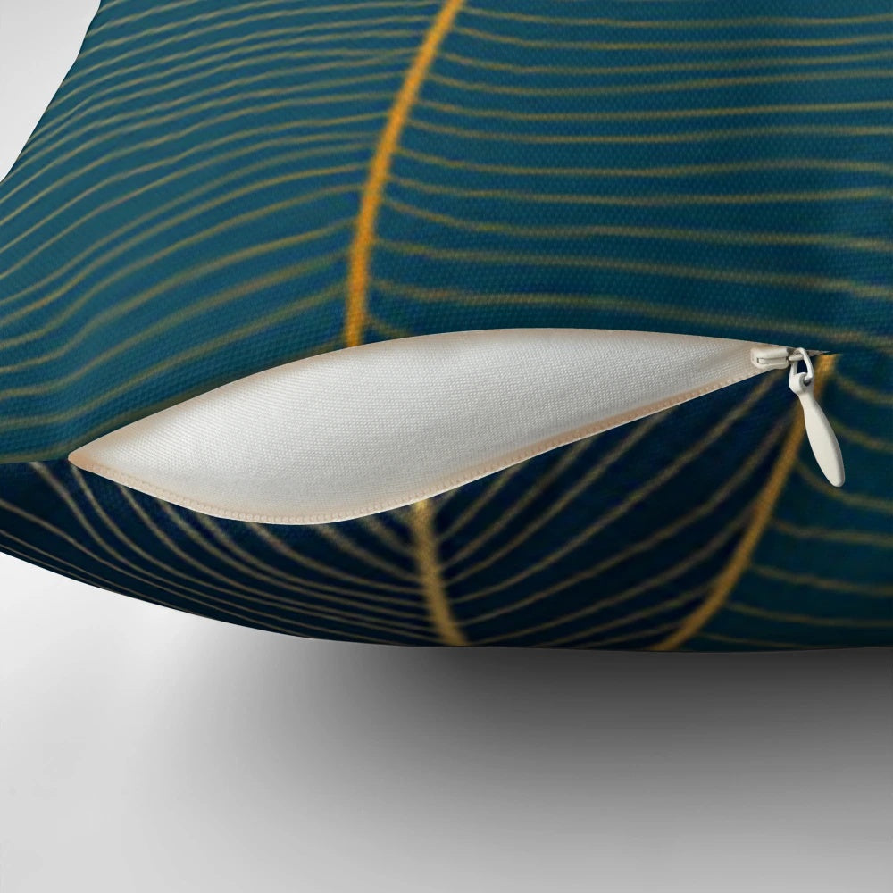 Luxurious art deco inspired pillow with botanical leaf pattern in shades of blue and green