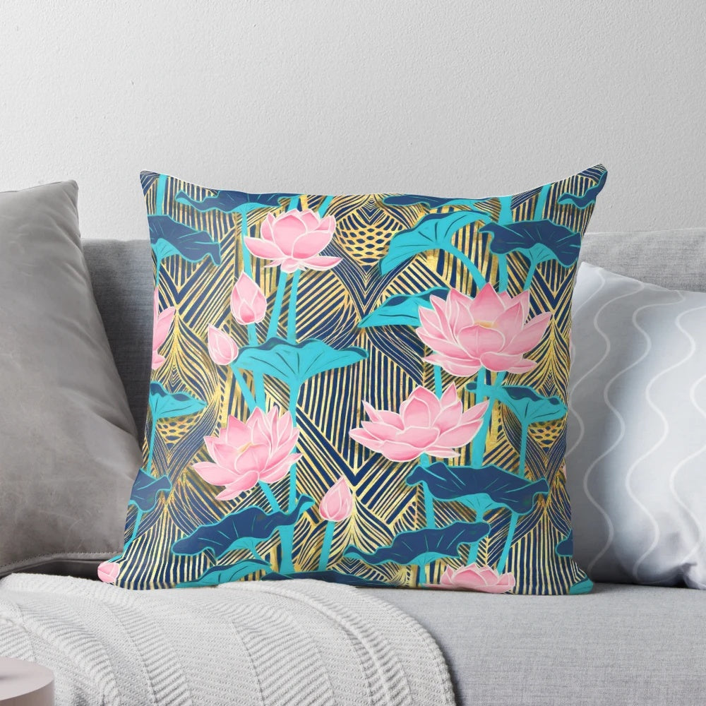 Decorative art deco style throw pillow featuring a pattern of pink and navy blue lotus flowers