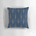 A navy blue decorative pillow with an art deco waterfall pattern in gold and dark colors