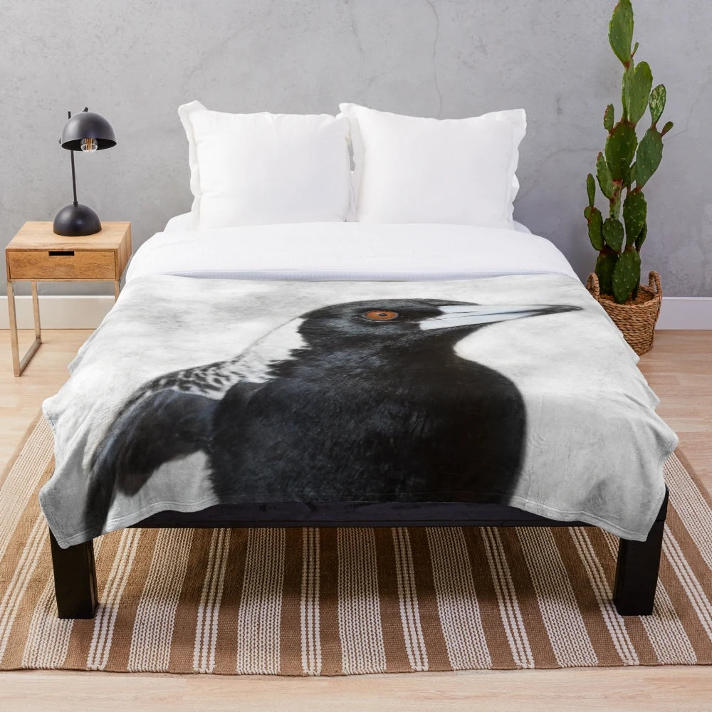 Soft and cozy plush blanket featuring a charming Australian magpie design by artist Christine Chester