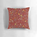 Autumn foliage-inspired throw pillow with red and green leaves on a neutral background