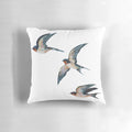 Vibrant acrylic painting of three elegant barn swallows in flight on a decorative throw pillow