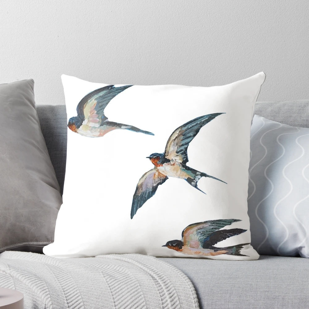 Vibrant acrylic painting of three elegant barn swallows in flight on a decorative throw pillow