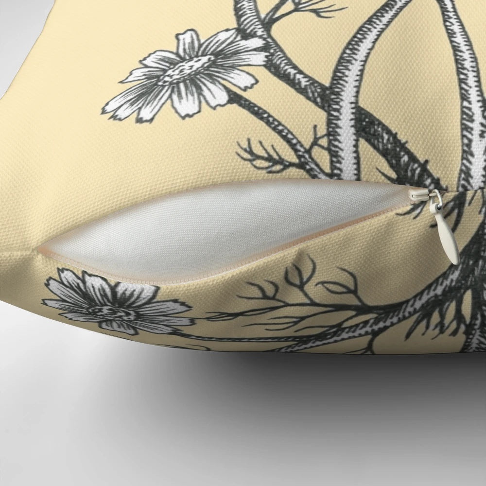 Pillow featuring a black and white ink drawing of bees and chamomile flowers on a honey-colored background