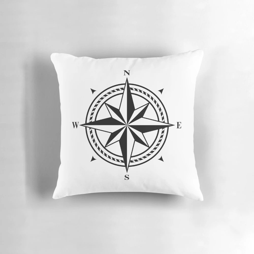 Black and white compass rose design printed on a soft, plush pillow