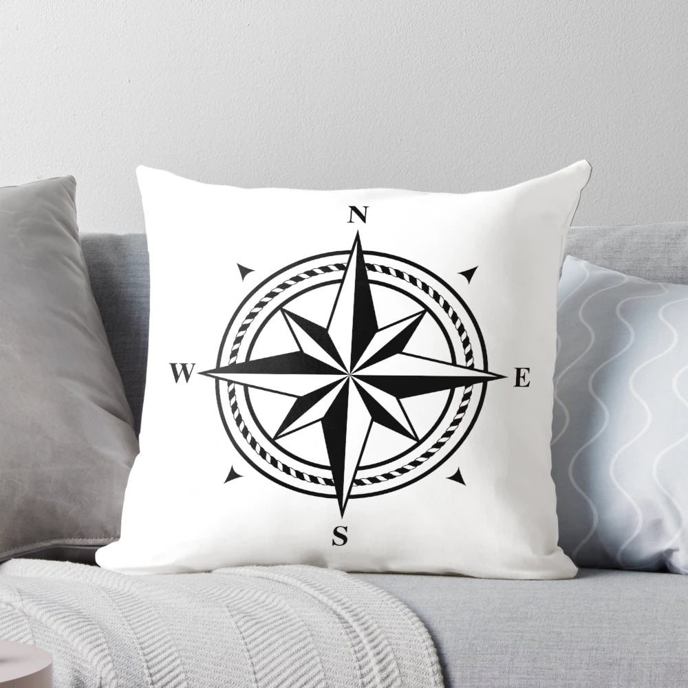 Black and white compass rose design printed on a soft, plush pillow
