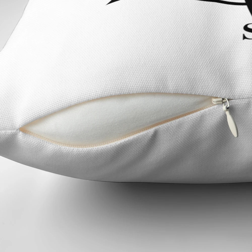 Black and white compass rose design printed on a soft, plush pillow
